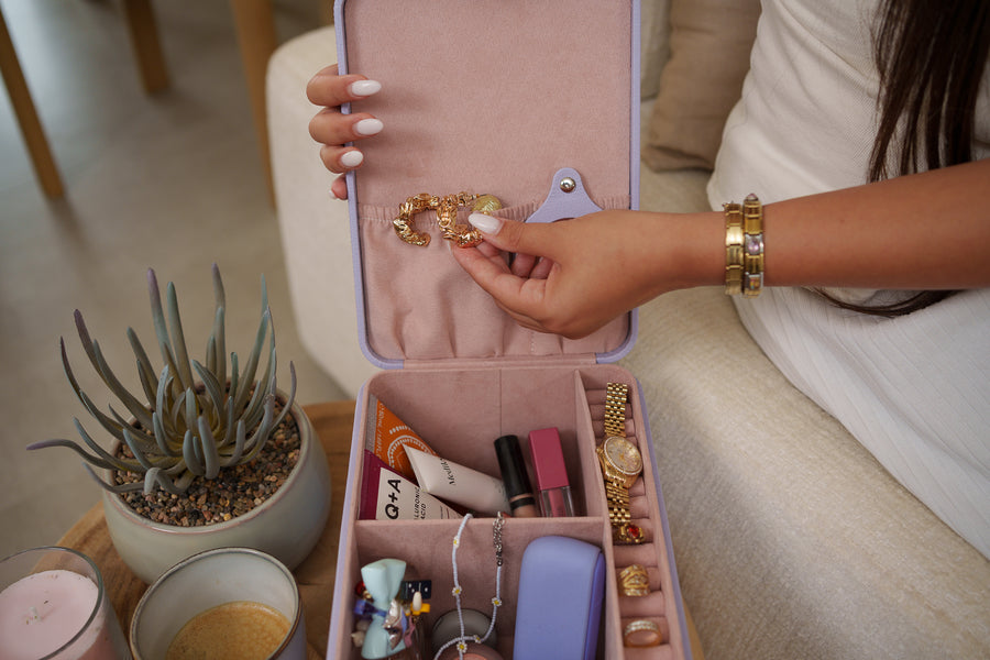 Jewellery and cosmetics organised inside an open lilac MumVault