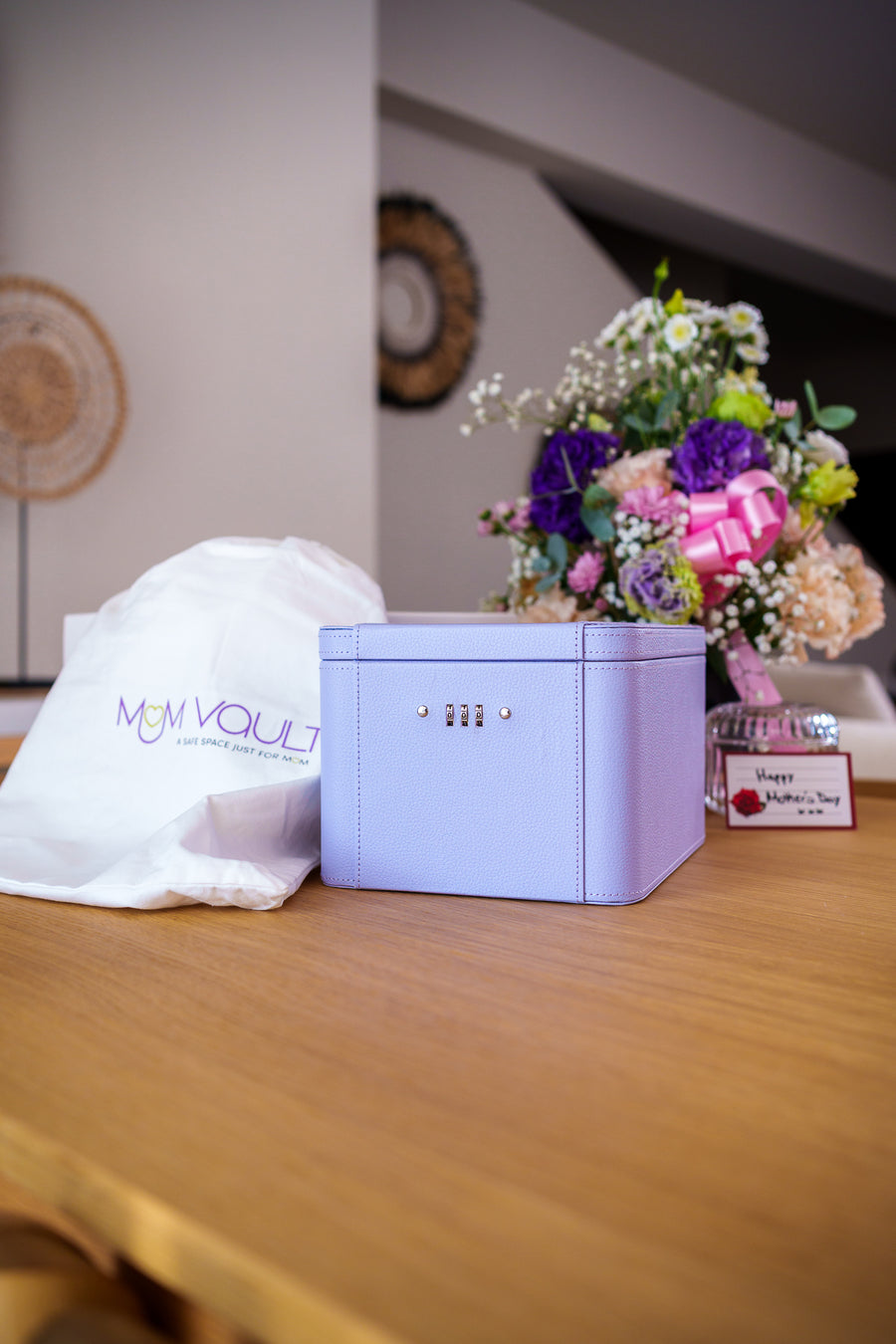 Lilac MumVault with branded dust bag and flowers